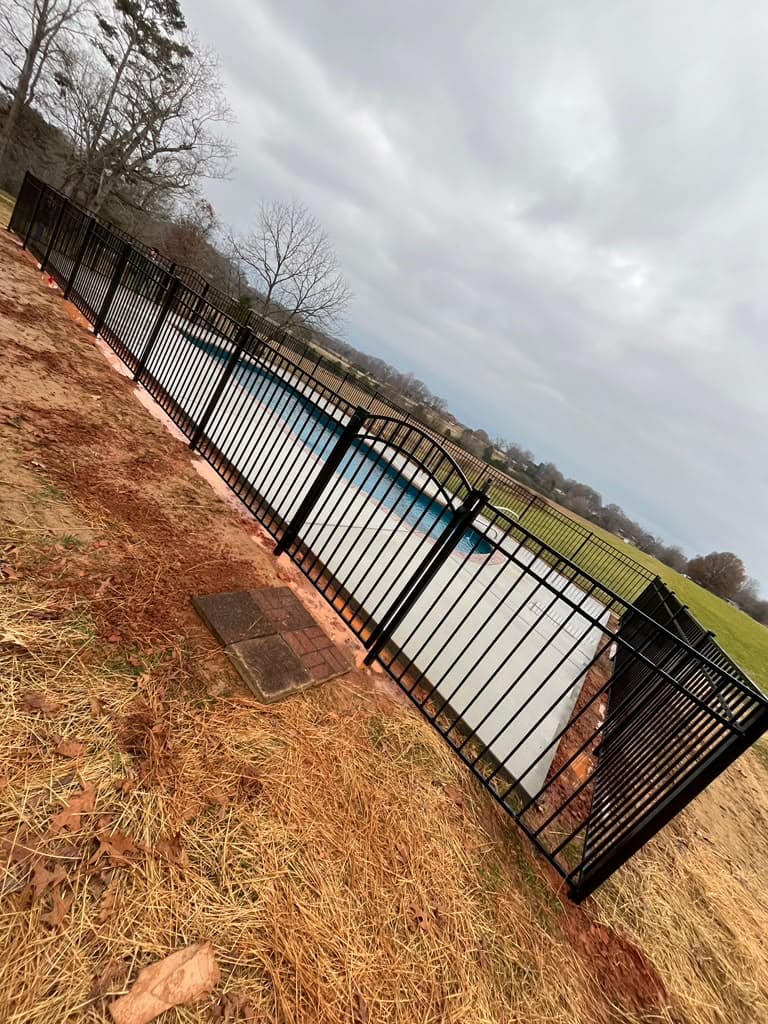 Completed aluminum fence installation by the Delgado Fence crew